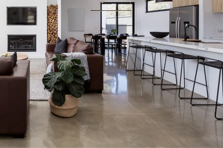 A contemporary living space with an integrated kitchen and dining area.