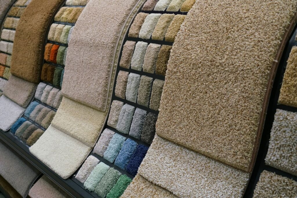 Array of flooring samples including carpet and hardwood.